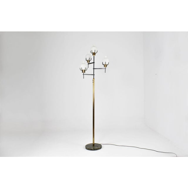 A stunning Italian 1950s mid-century modern floor lamp in the style of Angelo Lelii's work for Arredoluce. The lamp...