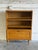 This versatile storage piece features open shelves above a drop-down compartment door. Its clean lines and functional...