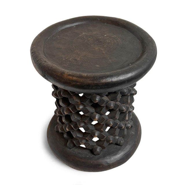 Authentic hand carved vintage Bamileke tribal wood stool. Masterfully crafted from one piece of indigenous wood....