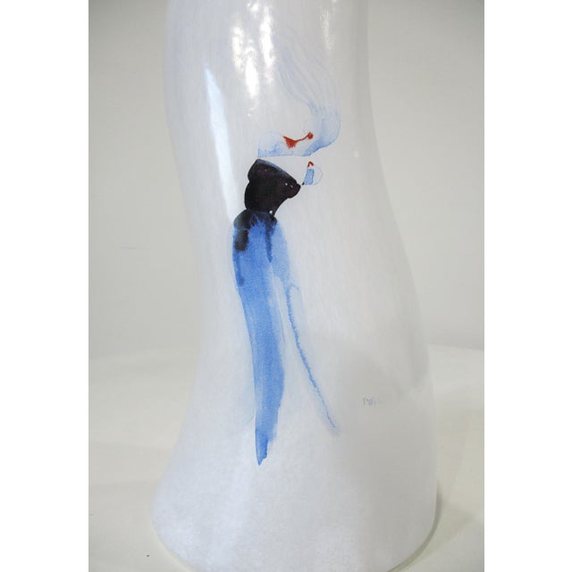 A large stunning handblown art glass vase with a floating woman design titled " Catwalk" by artist Kjell Engman. Thie...
