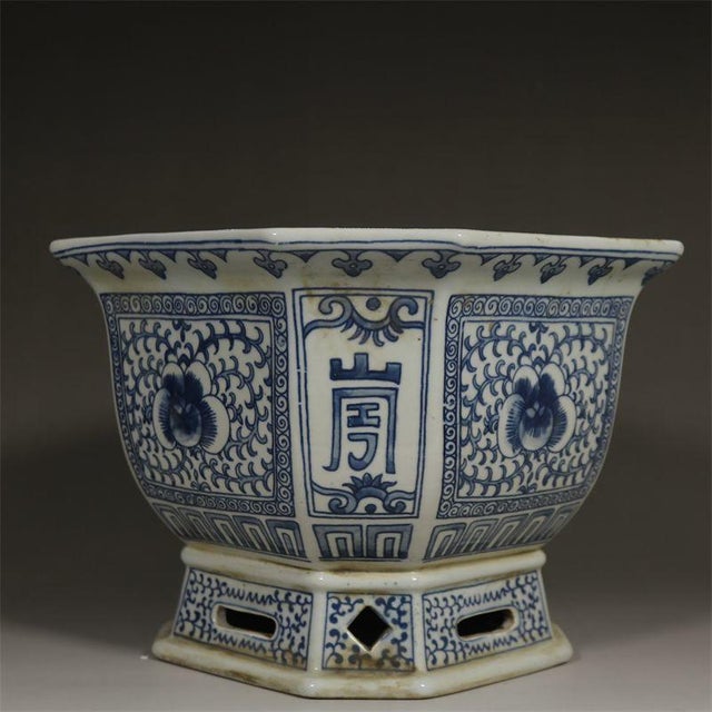 This striking antique porcelain planter features a hexagonal form with a flared rim, resting upon a matching pedestal...