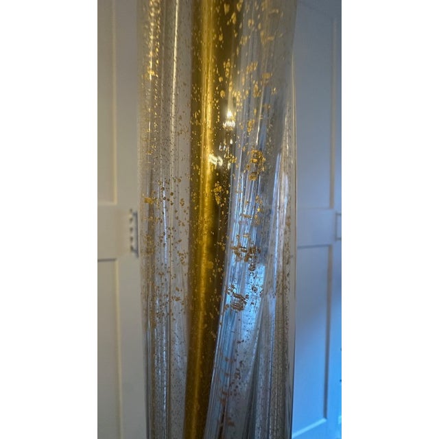 Gorgeous Donghia floor lamp featuring hollow, handblown Venetian glass. Sculptural column with a twisted form and...