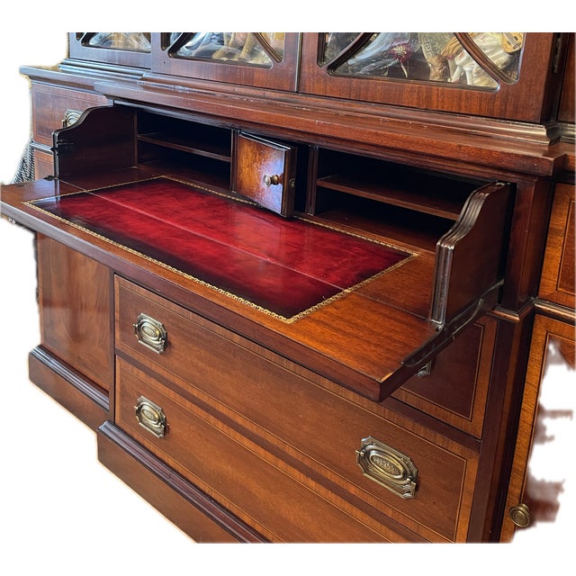 American, Federal Style Mahogany Breakfront. Bombe' Glasses with delicate framing around. Delicate inlaid work over doors...