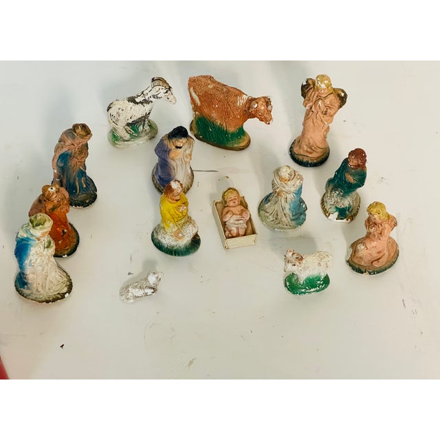 Antique set of 14 Nativity scene figurines.