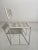 Chair with painted steel structure in the white color, seat and back are in white pvc rod. This piece has an attribution...