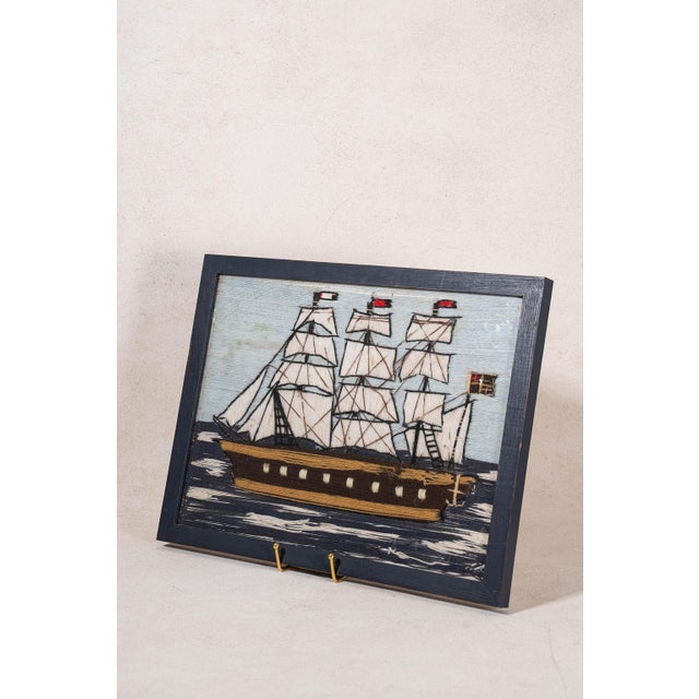 19th-century sailor’s woolwork depicting a maritime scene, hand-stitched in colored wool and presented in a period-style...