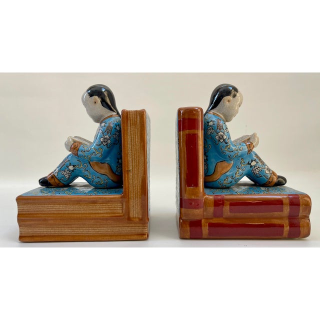 Gorgeous hand-decorated in stunning colors porcelain Chinese figurine bookends. Both in excellent condition. Maker's mark...