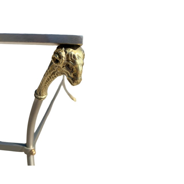 We have for your consideration a very beautiful Mid Century modern Hollywood regency Table.table consists of 4 brass rams...