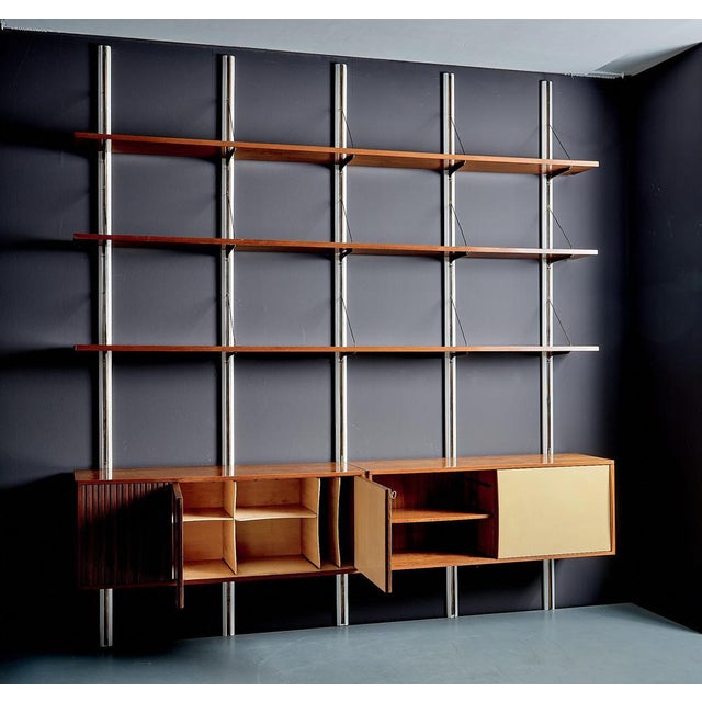 Unique wall unit with matching credenza designed by Elio Monesi (1927–1994), created for his private home in Milan. The...