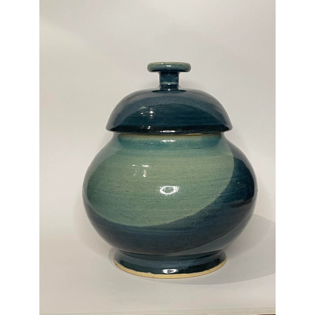 There's an abstract modern feel to this lidded ginger jar. The variation of colors from light to dark blue, to light green...