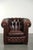 This beautiful English-style Chesterfield armchair is made of cowhide and features a stunning classic color scheme. It has...