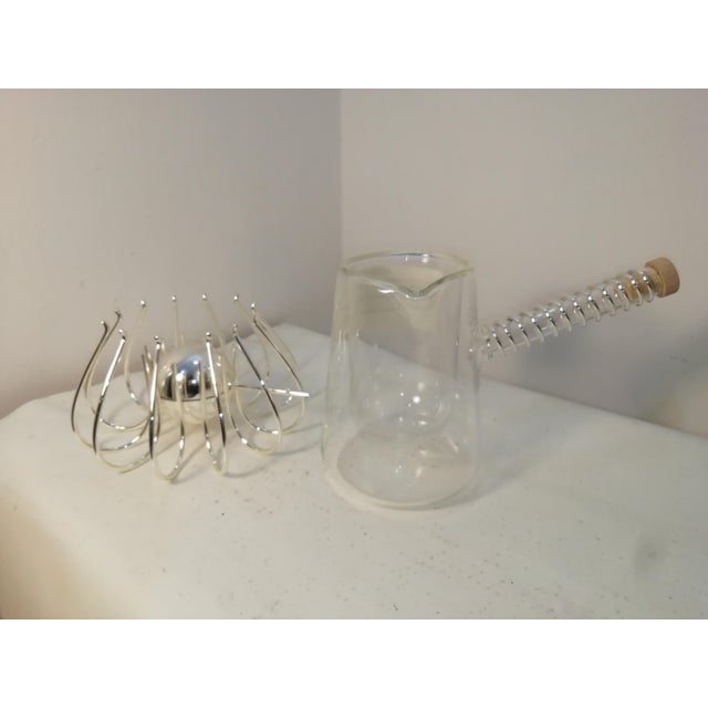 Characteristic set consisting of a Medusa food warmer and a Peyrano chocolate pot, designed and produced by Lino...