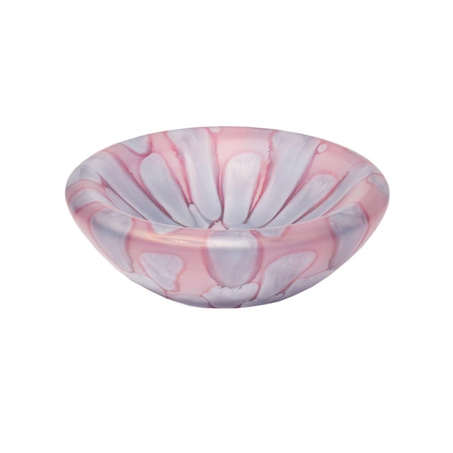 A purple and pink glass bowl designed by Gallo Glass. The bowl has a dripped design and a satin finish.