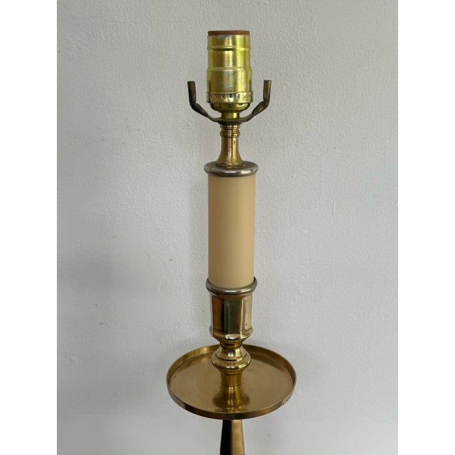 Tall brass candlestick lamp with carved wood base. Stately and masculine. Please see condition details noted. Most items...