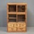 Early 1920's Japanese cedar display cabinet with sliding glass doors and five drawers. Very clean and lightweight with...