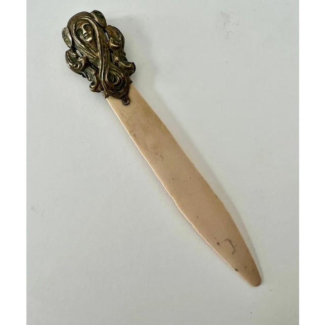 Acquired in Paris, this lovely Brass and bone art nouveau letter opener has a beautiful patina that will give your desk or...