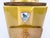A charming mid-century French manual coffee grinder by Peugeot Frères, featuring a distinctive mustard-gold painted metal...