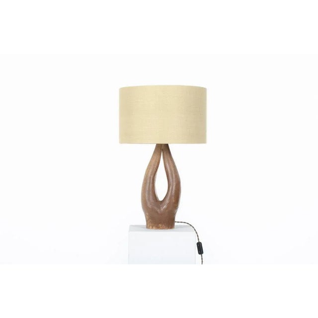 Table lamp made in the 60s in France Brown ceramic base and custom lampshade European Plug (up to 250V).The wiring of this...