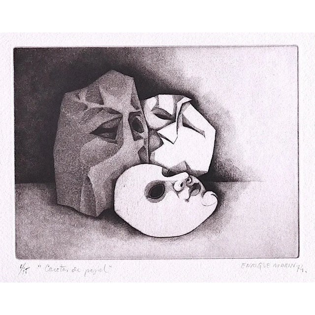 Caretas de Papel 1974 is a splendid print in etching technique engraved by the Enrique Marin (1935-2020). The state of...