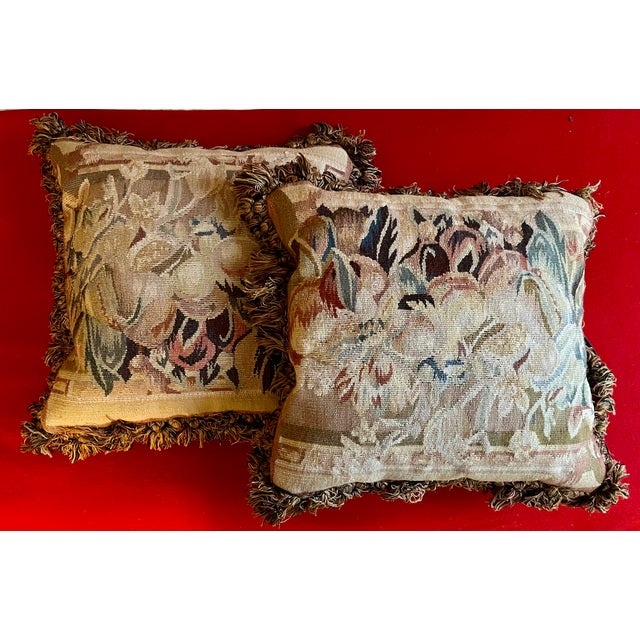 Pair antique 19th century French Aubusson tapestry pillows with passementerie fringe trim. A beautiful pattern of fruits...