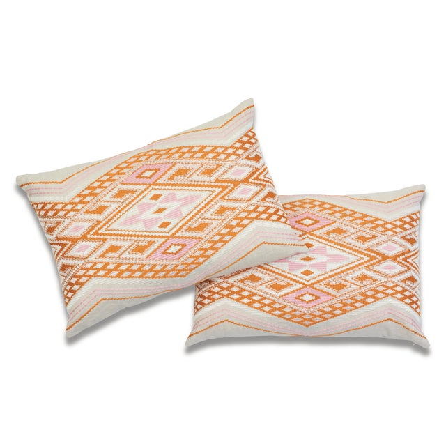 This 16" x 24" pillow features Bayeta Embroidery in Pink & Orange. Inflected with a chic tribal aesthetic, this...