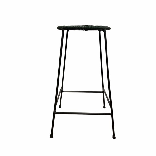 Vintage metal frame stool with wicker seat. Reenforce seat makes for sturdy sitting. Could also be used as a plant or...