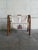 Smooth arched rattan frames support a double-pocket canvas sling featuring an embroidered flower motif. This charming...