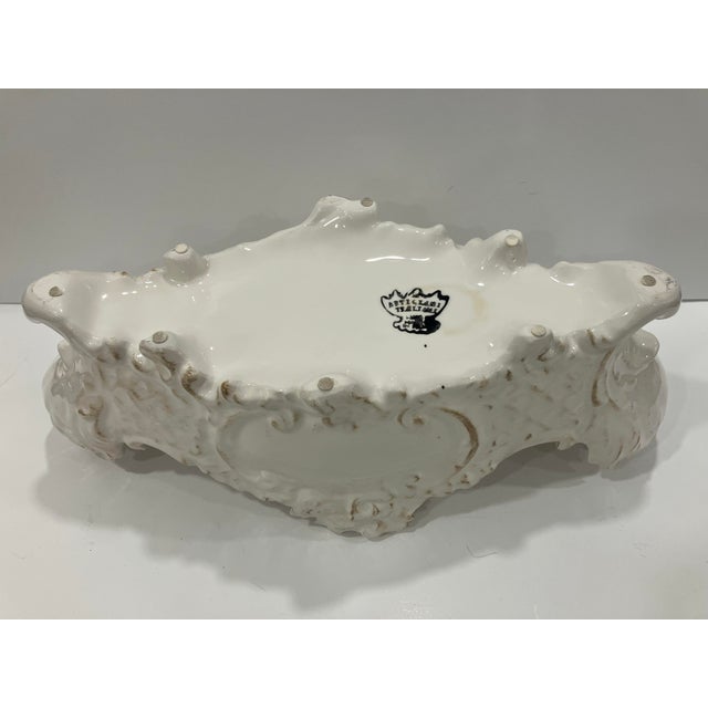 This Italian ceramic jardinere is in the Rococo style. The Rococo style is a dramatic & ornamental art style that features...