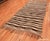 This chic vintage Moroccan Kilim features an abstract pattern of expressive stripes and geometric decorations rendered in...