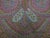 Victorian era micro-beaded pouch featuring an intricate colorful paisley and floral pattern in muted shades of pink, blue,...