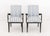 Pair of Contemporary Ebonized Arm Chairs, with blue and white striped cotton upholstery. 34.5" H x 20" W x 22" D; seat:...