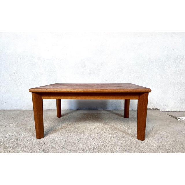 This high-quality low side table was manufactured by Trioh in Denmark during the 1960s. It shows a beautiful wood grain in...