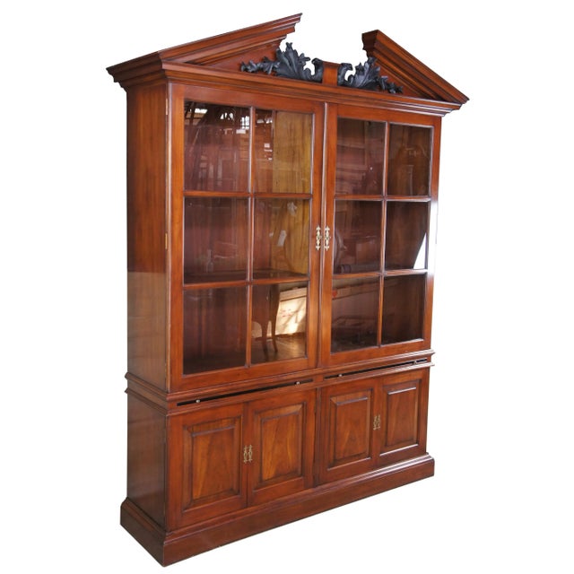 Late 20th century George II style library bookcase by Arthur Brett. Made from mahogany with a wide base featuring two six...