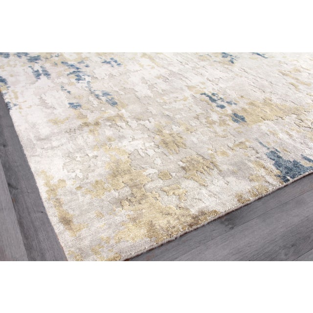 Our Laureno rug is hand knotted of Bamboo silk and is the absolute definition of “Art for the Floor.” A borderless...