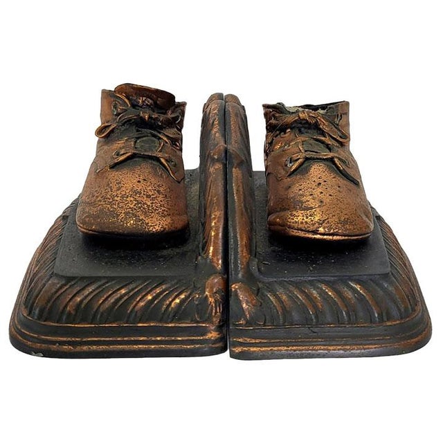 Rare set of copper bronzed baby shoes that were up cycled to create bookends. These would make a great baby gift or...