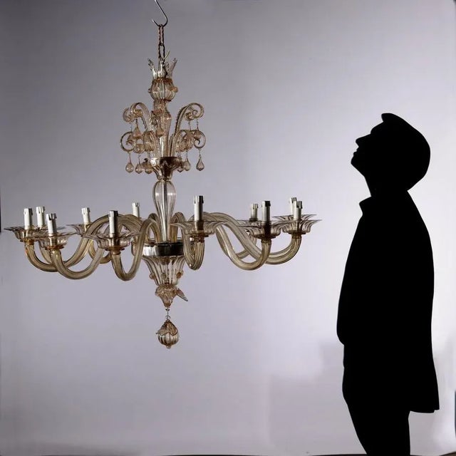 Murano chandelier in blown glass, 12 lights; It has small breaks. This piece is attributed to the mentioned...