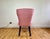 Pair of vintage dining chairs featuring an elegant sculptural silhouette with softly curved backs and tailored pink silk...