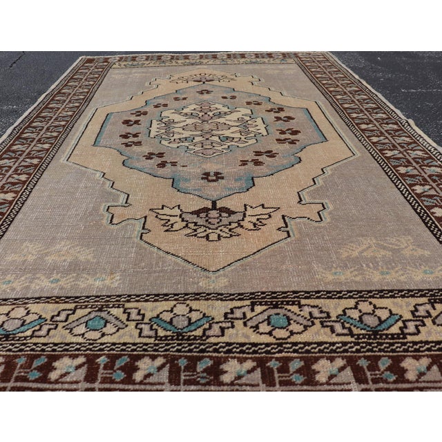 Vintage Turkish Medallion Oushak Area Rug in Gray, Taupe, Brown and Cream This piece was hand-knotted in the mid-century...