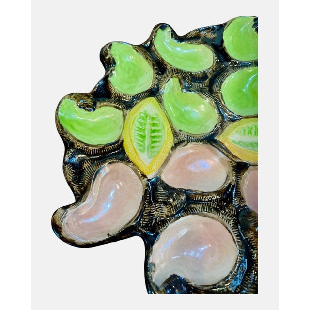 Beautiful mid century oyster platter. It has a Freeform design, mimicking a cluster of shells. It features a pink and...