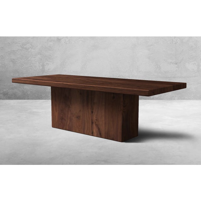 Handcrafted Luxury Elevate your dining experience with this hand built Walnut Dining Table featuring a box style base, a...
