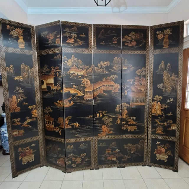 "A magnificent Early 20th Century Chinese Coromandel lacquer folding screen, exquisitely gilt hand-painted and Duiqi...