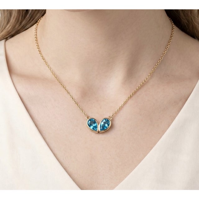 Celebrate timeless elegance with this beautifully crafted double pear gemstone necklace, designed to symbolize connection,...