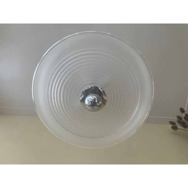 A beautiful Art Deco lamp from the 1930s in France. The lamp features a unique and beautiful chrome pendant. It has an...
