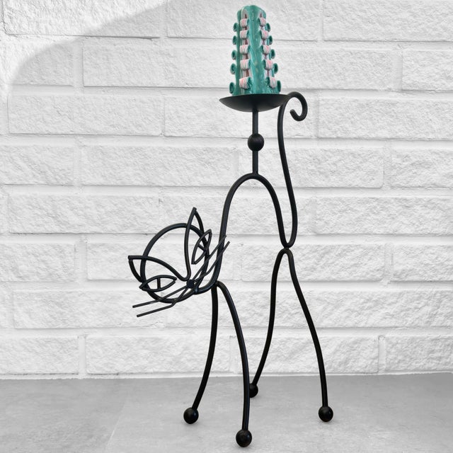 A large, sculptural floor-standing candle holder, model Huskatt (House Cat), designed in the 1950s by Gunnar Ander for the...