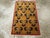 This Mid-20th century Turkish Art Deco throw rug, measuring 2' 0" x 3' 0", is a striking example of modernist design...