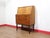 This Mid Century Modern Vintage Teak Secretaire Bureau Desk in Danish style is a stunning secretaire that embodies great...