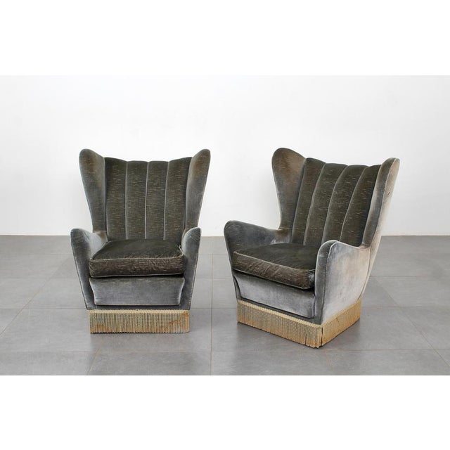 Pair of high-backed armchairs in green-gray velvet with wooden legs. Attributed to Guglielmo Veronesi, Italian...