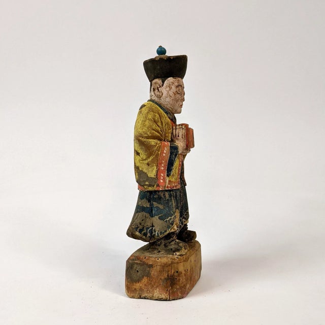 This wooden official is painted with mineral pigment. There is natural wear and tear on the paint and the wooden has a few...