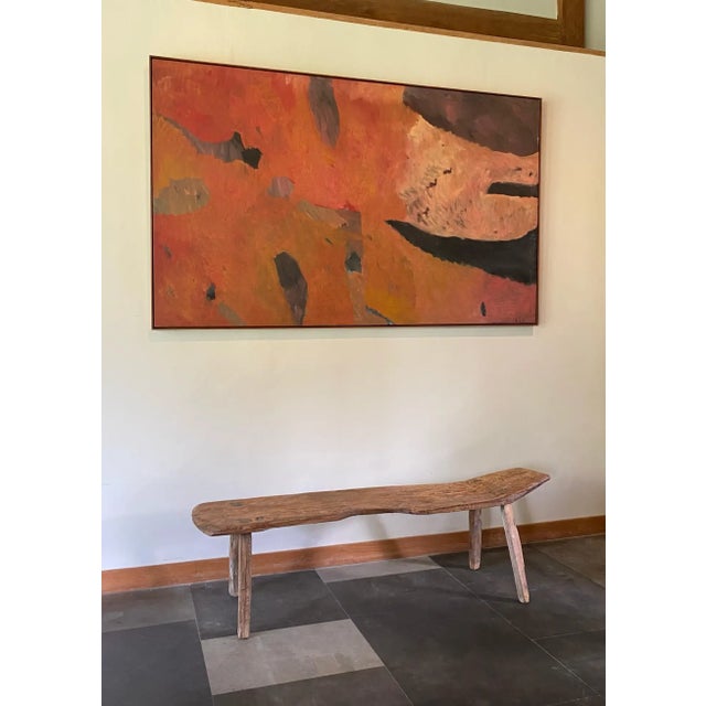 This hand-carved teak wood bench originates from the Island of Madura, off the coast of Northeastern Java. It features a...