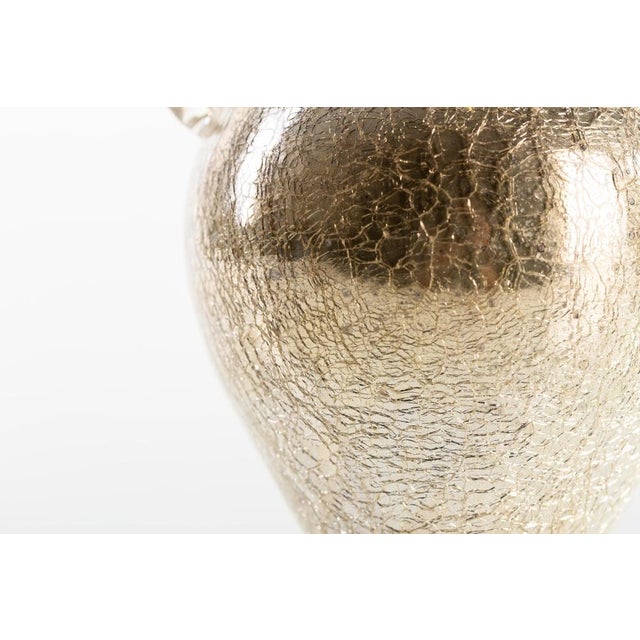 This cracked glass vase is an original glass vase realized in Austria, circa 1950s of the 20th century. Domed with two...